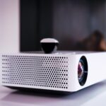 black and white projector on white table